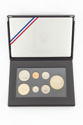 Framed collection of vintage collectible coins.